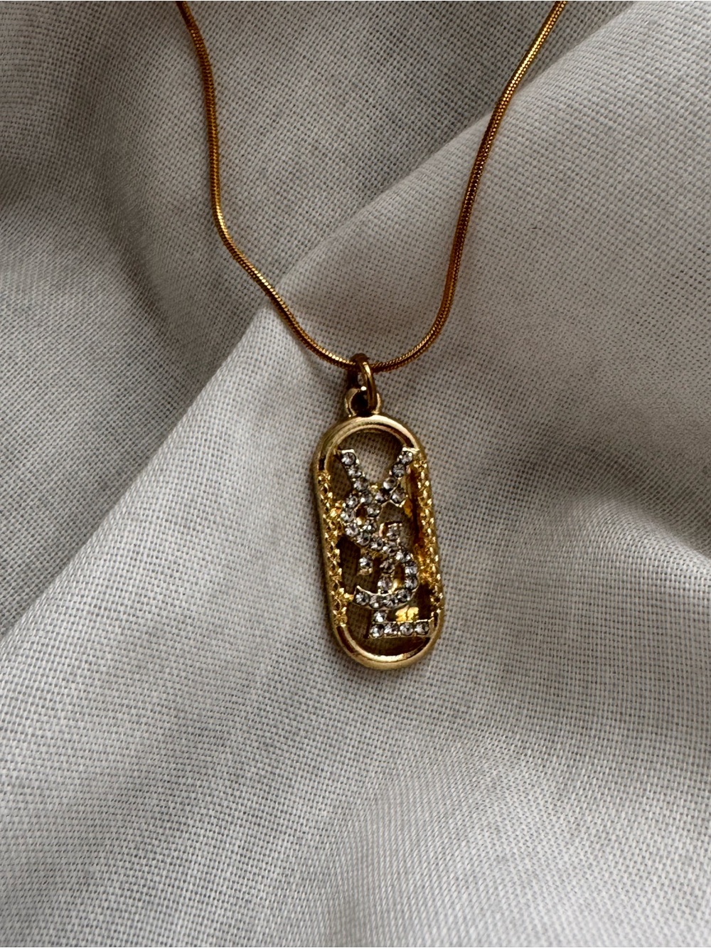 Yves Saint Laurent Gold and Pave YSL Monogram Pendant Necklace